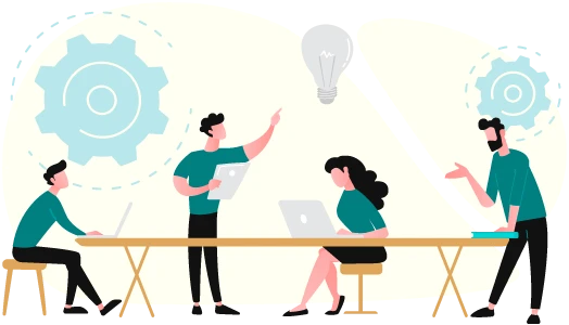 A group of people sitting at a table with laptops