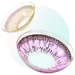 A pair of pink colored contact lenses sitting on top of a white surface
