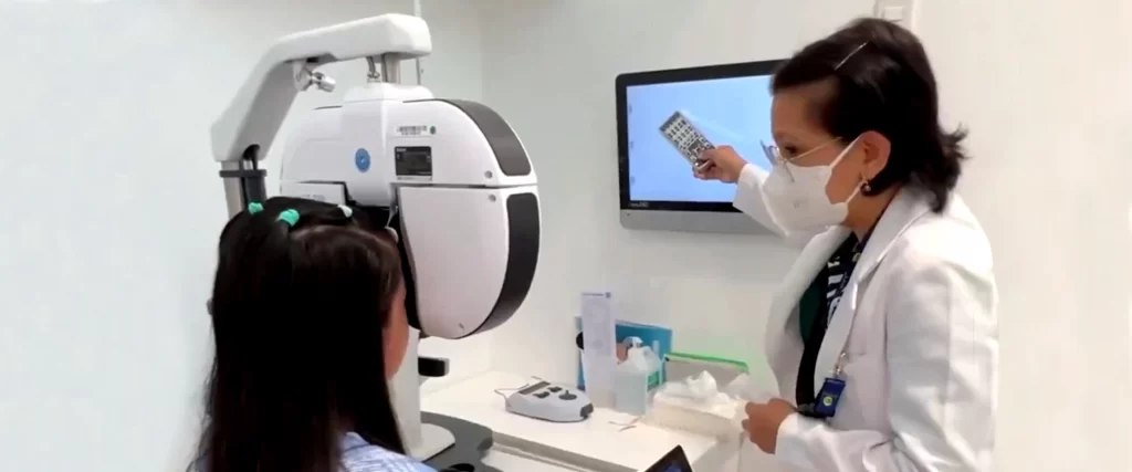 A kid having an eye checkup