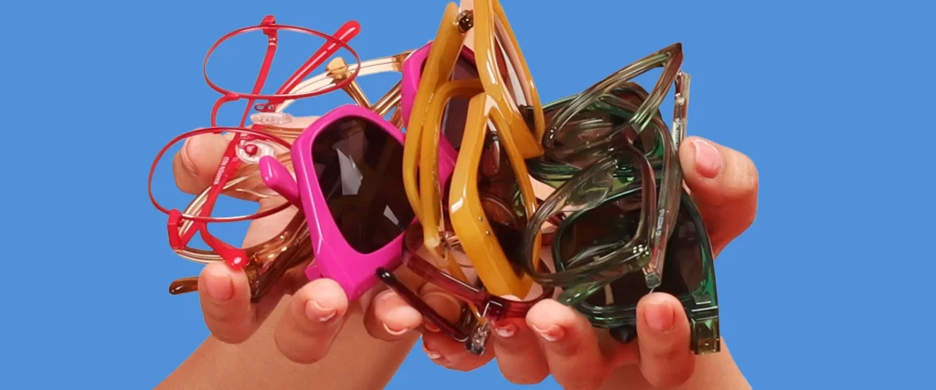 Hand Holding Eyeglasses