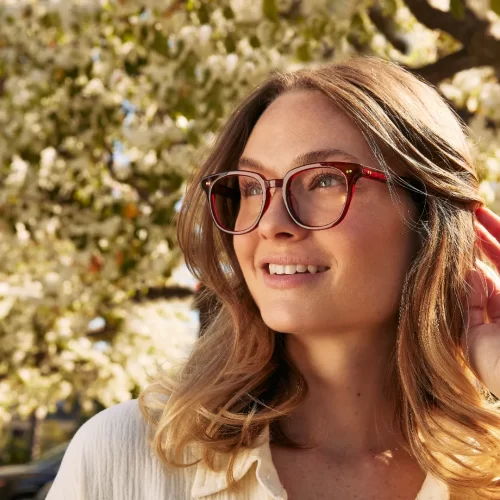 toms-3 woman wearing toms eyeglasses in a red frame
